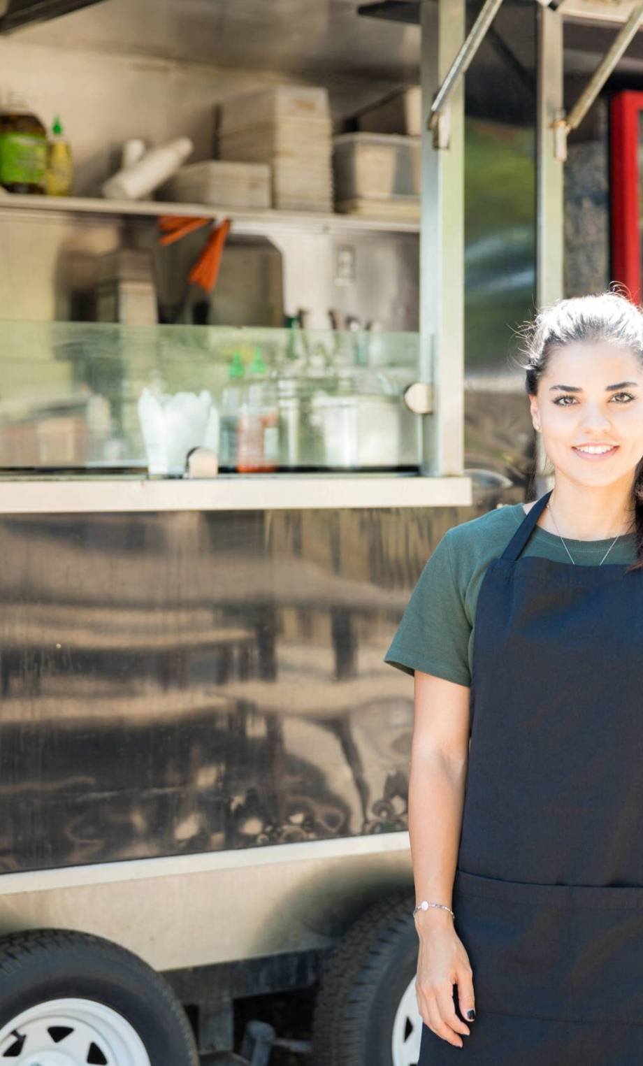 Portrait of a gorgeous young Hispanic food truck owner ready to cook