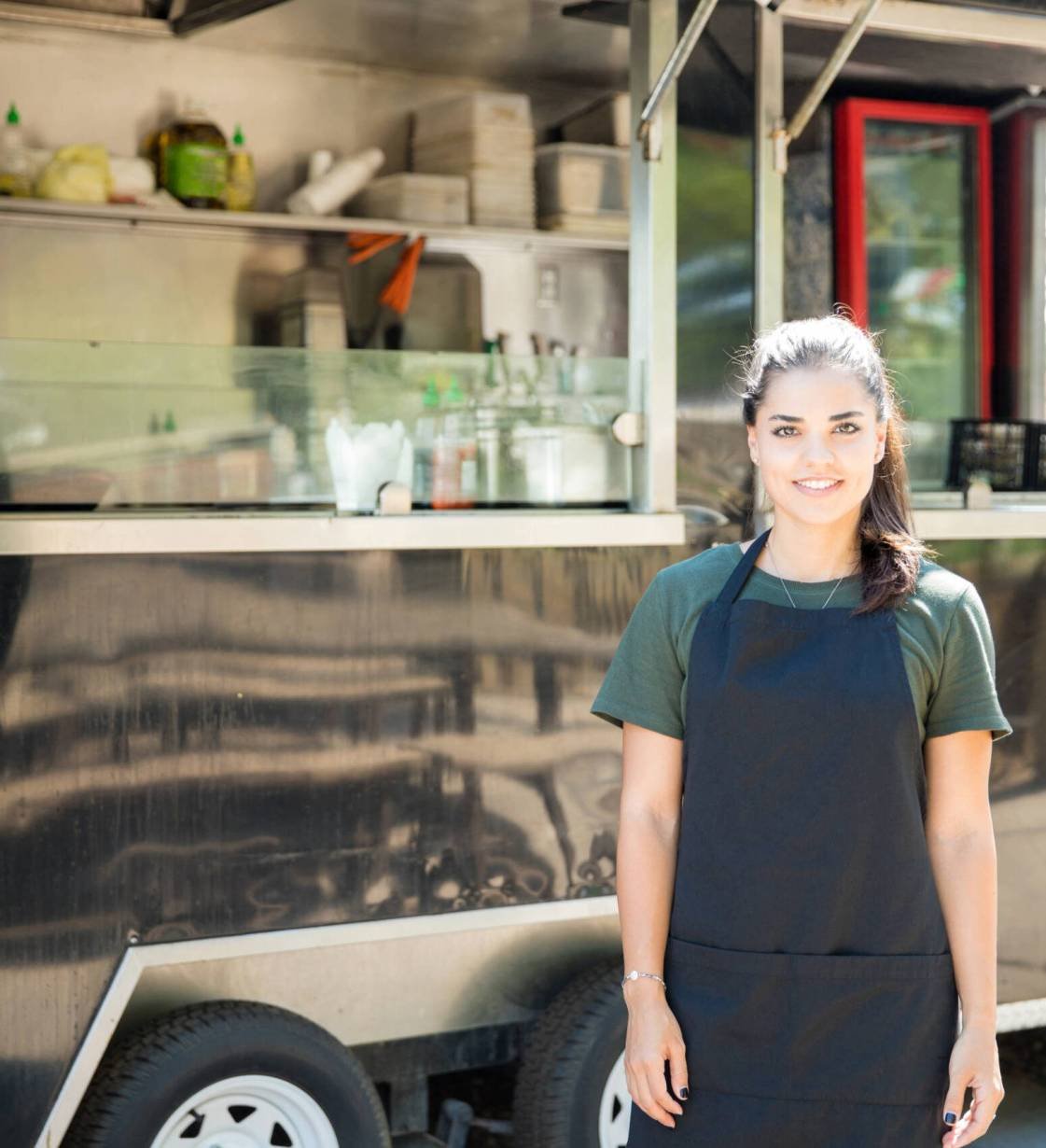 Beautiful food truck owner Portrait of a gorgeous young Hispanic food truck owner ready to cook